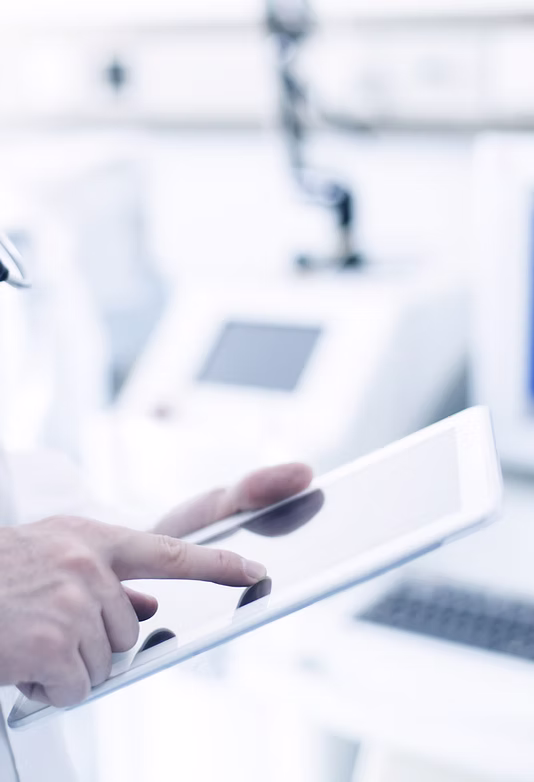 A healthcare professional using a tablet